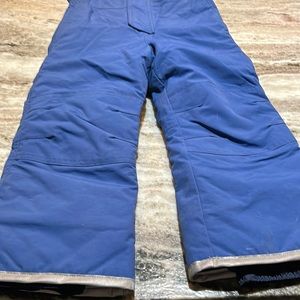 child’s blue snow pants